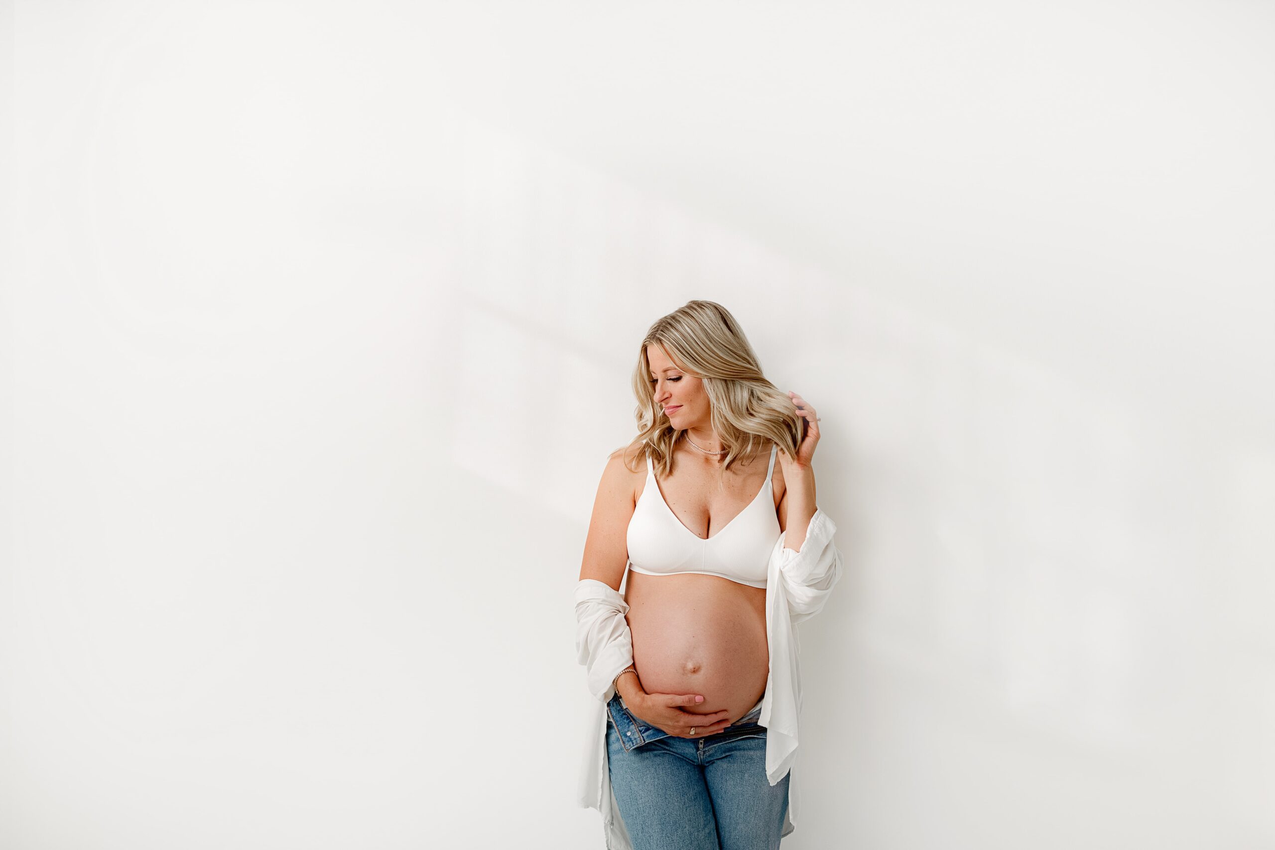 Expectant mother photographed in a modern studio