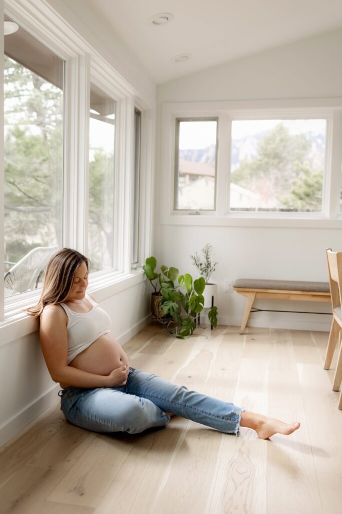 Lifestyle maternity photos feature soft textures and neutral tones during this maternity photography shoot in Boulder.