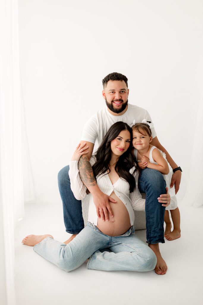 Soft studio lighting enhances this romantic maternity photo session in Northern Colorado.
