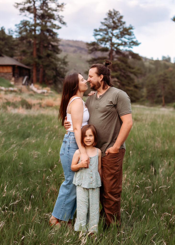 Extended family gathered at sunset during a summer photoshoot in Colorado, featuring grandparents and grandkids.