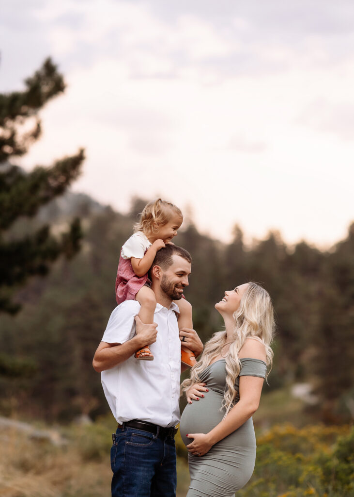 Denver maternity photography session with family in soft neutral outfits and natural light