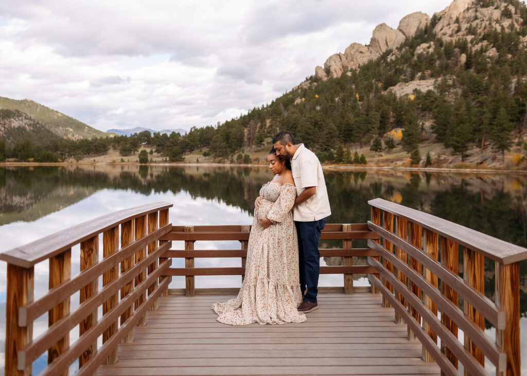 Outdoor maternity photography in Rocky Mountain National Park with mountain views and natural light