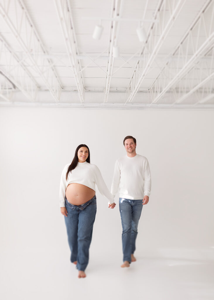Pregnancy photography in a light-filled studio designed for calm, refined maternity portraits