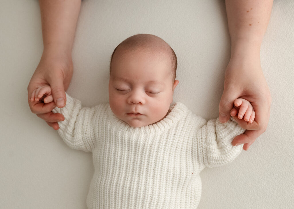 Calm newborn photography session in a neutral studio setting