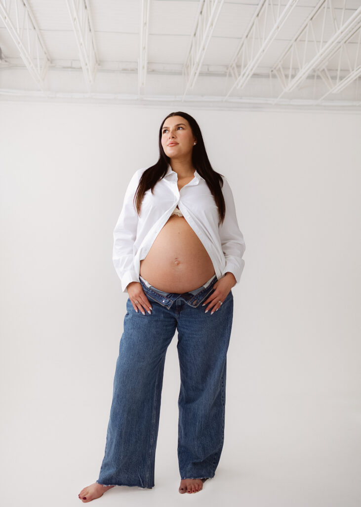 Studio maternity photos in a light-filled Northern Colorado studio focused on connection and form