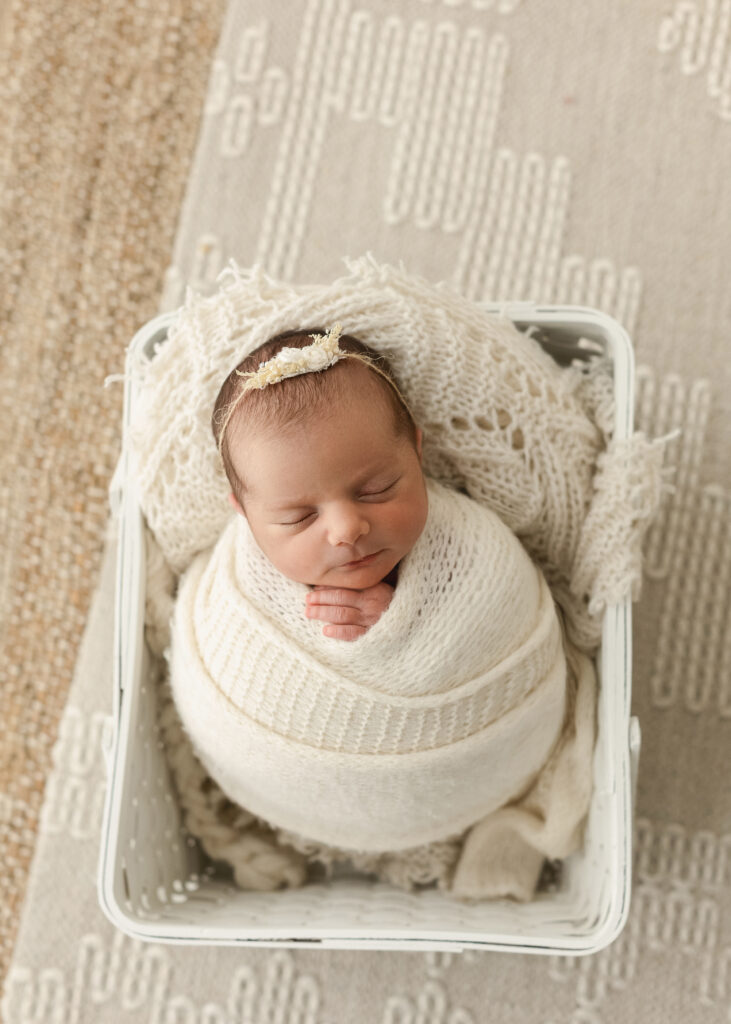 Baby-led newborn photography session in a Denver studio focused on comfort and safety