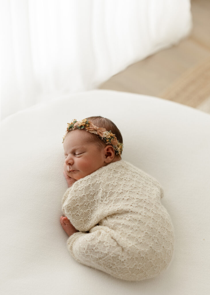 Quiet newborn photography moment capturing connection between baby and parent in Denver
