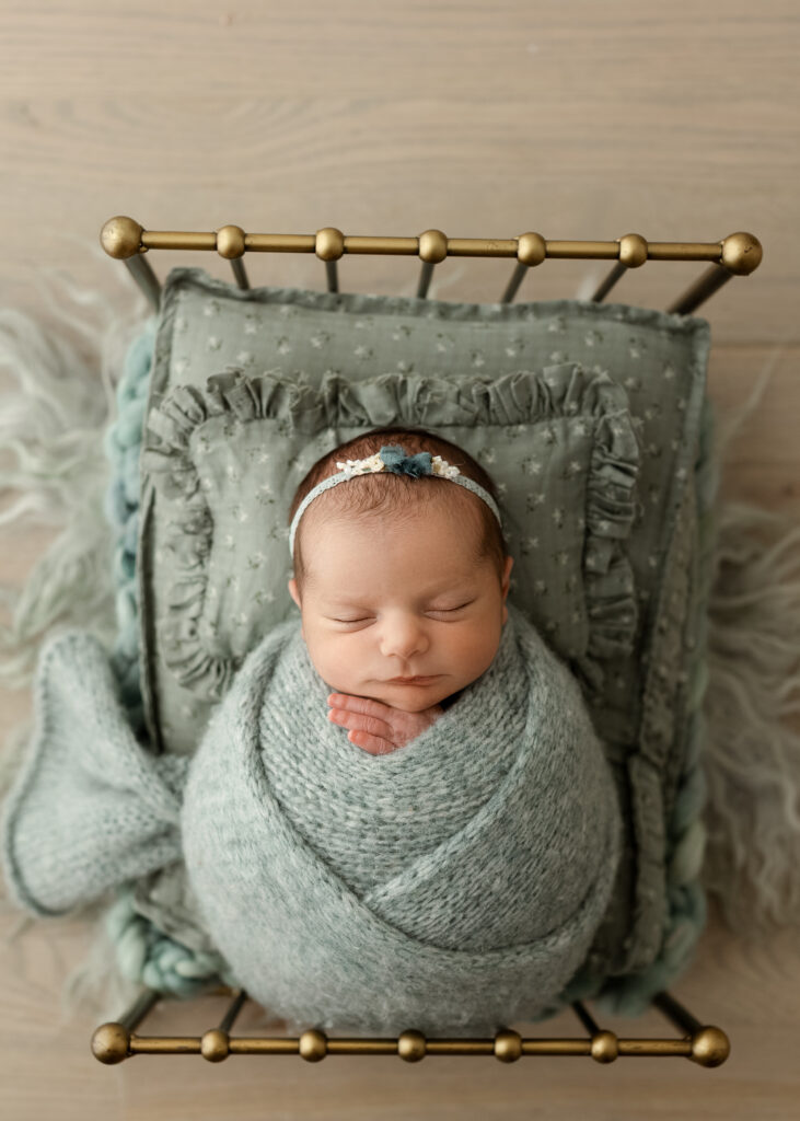 Parents holding their newborn during a Denver studio newborn photography session