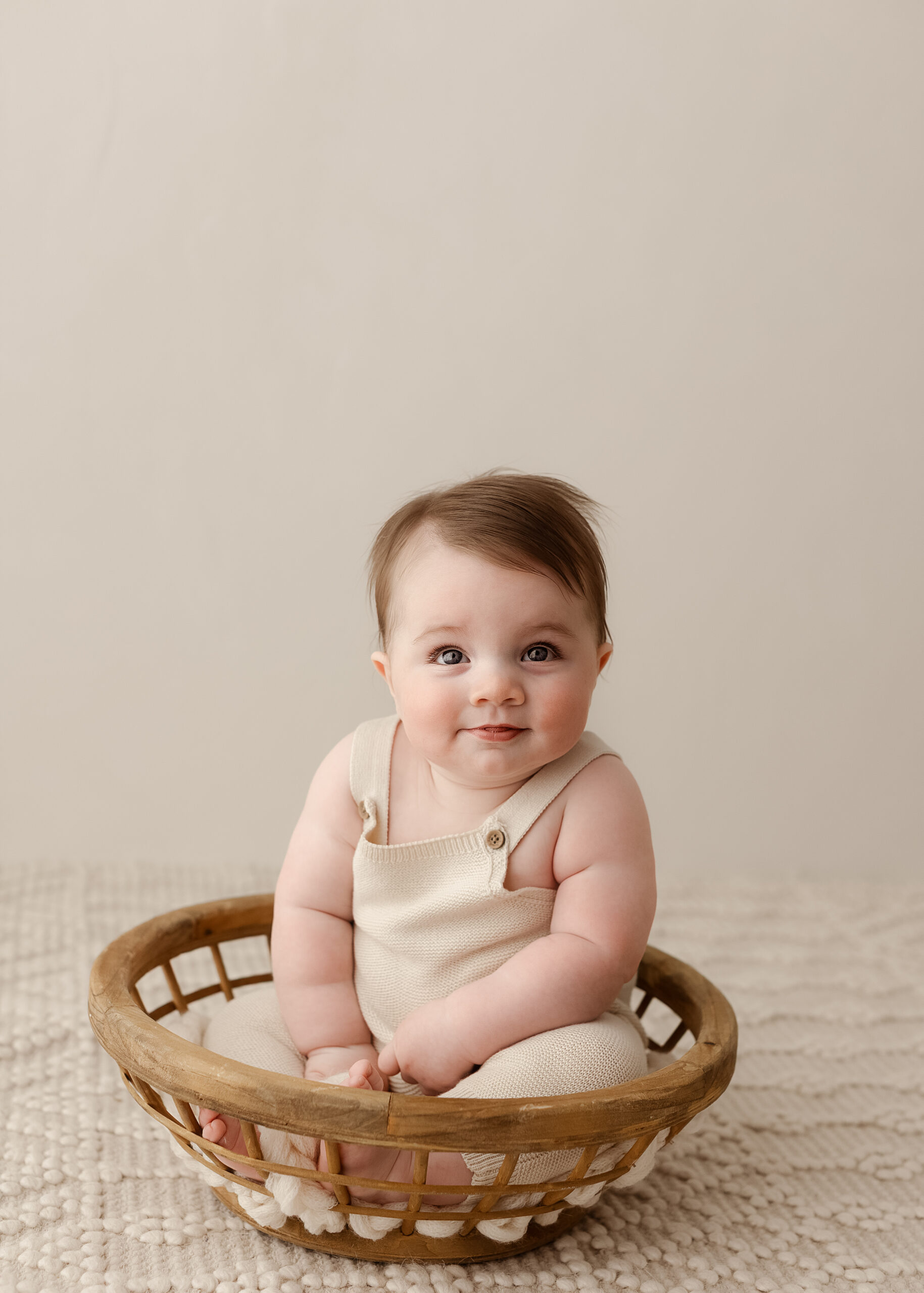 six month baby photography Denver with neutral tones and timeless style