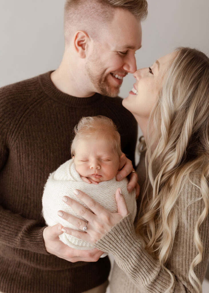 Denver newborn photographer baby in arms neutral studio