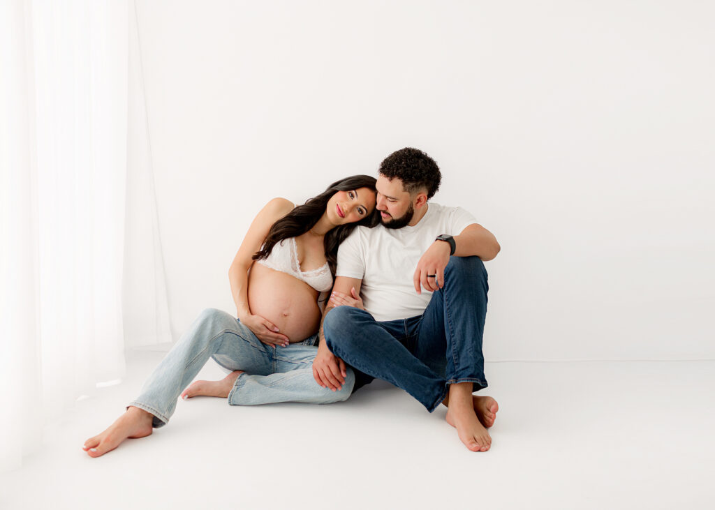 Neutral maternity photo outfit with soft textures and natural light in Denver studio