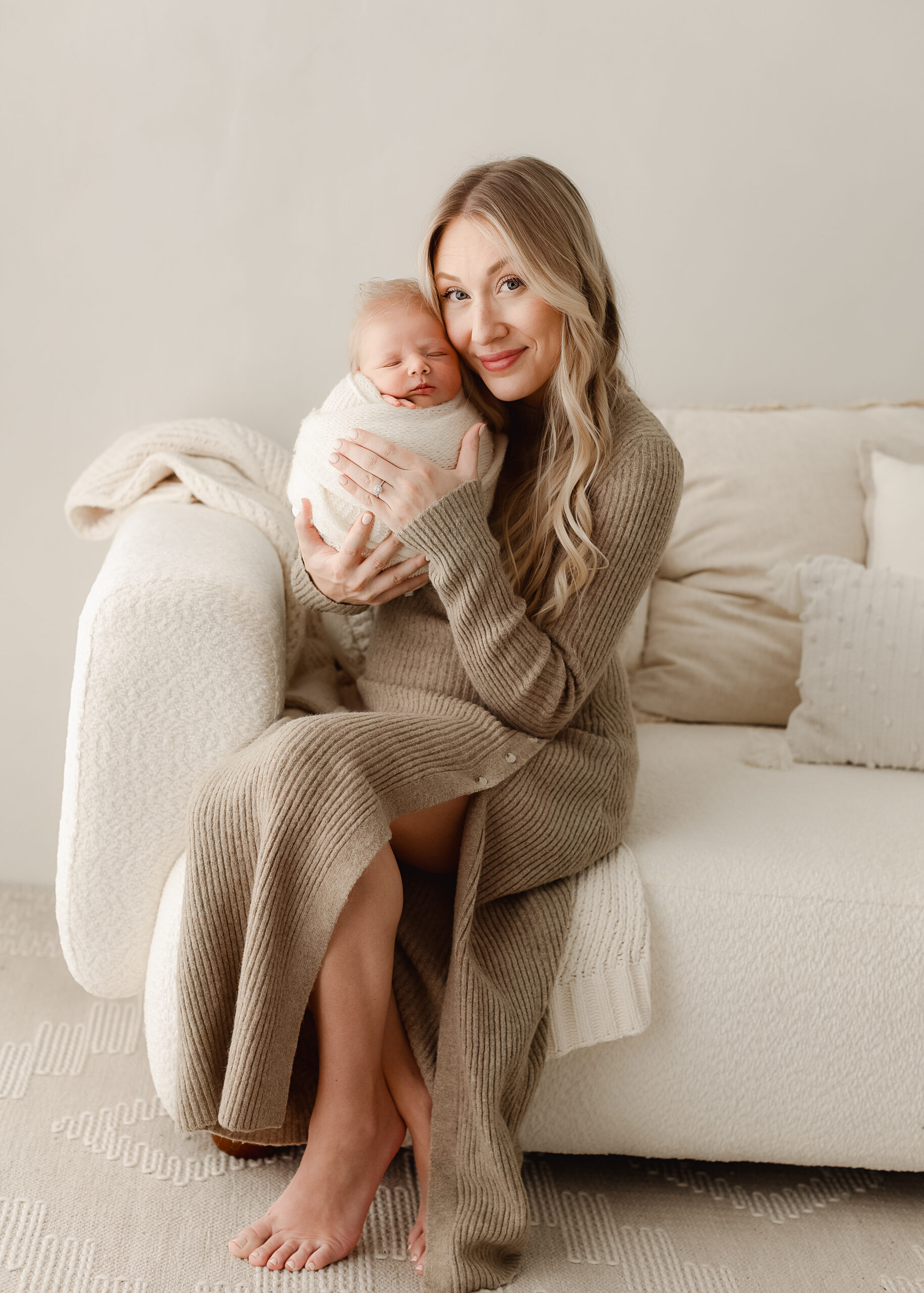 newborn photos Denver mother holding baby studio neutral tones