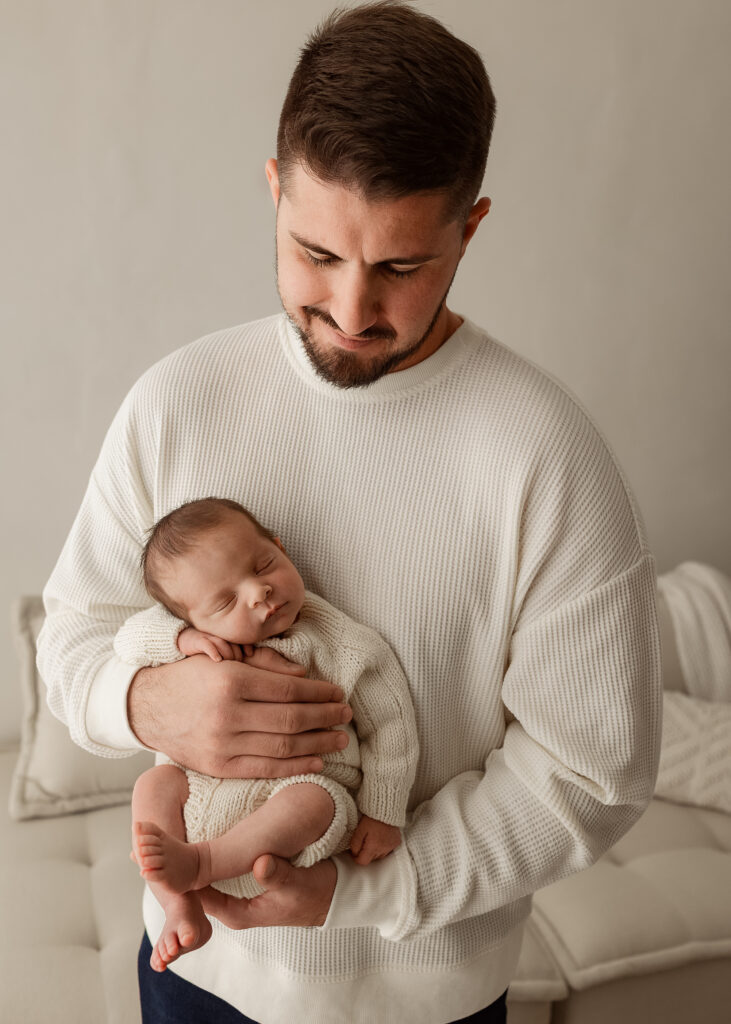 newborn baby posed in neutral studio setup during newborn photography session in Denver