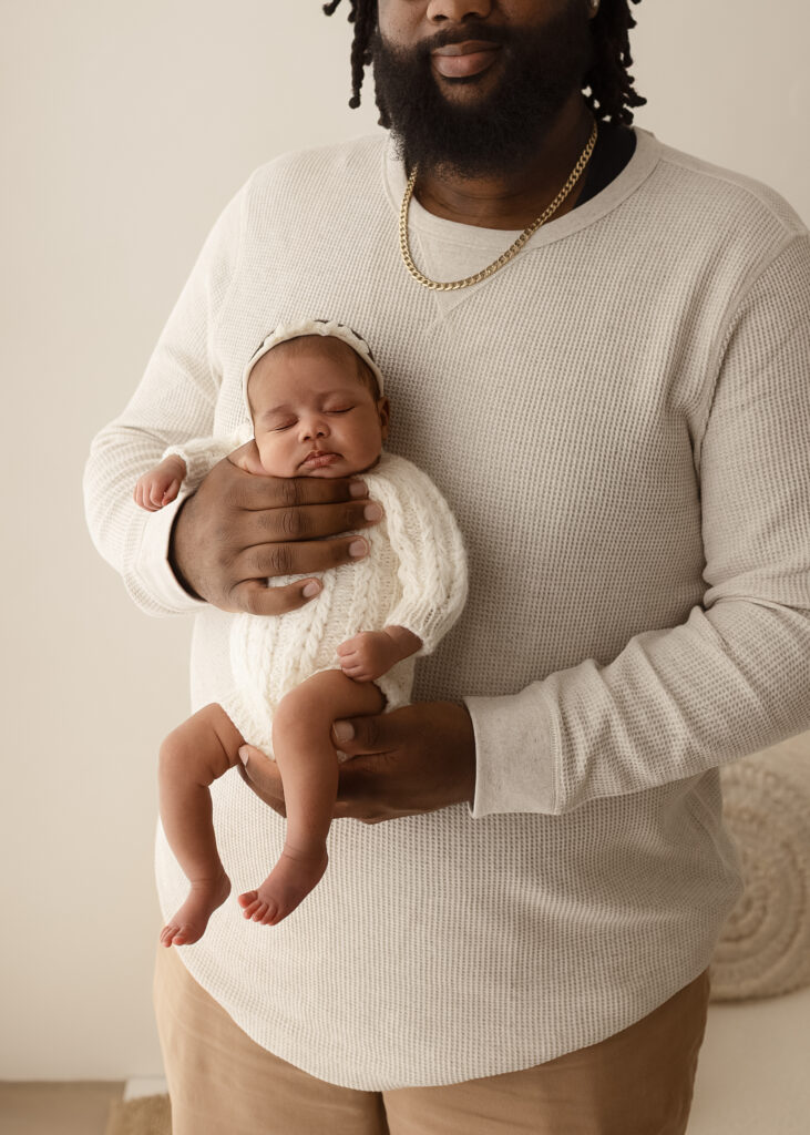 Newborn photos with parents in Denver studio featuring natural family connection